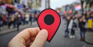 man holding location marker