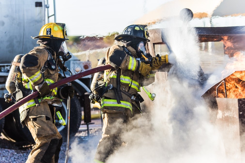 Firefighters extinguishing a fire.