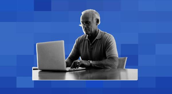 older man using computer